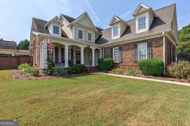 view of front of property with a front lawn and covered porch