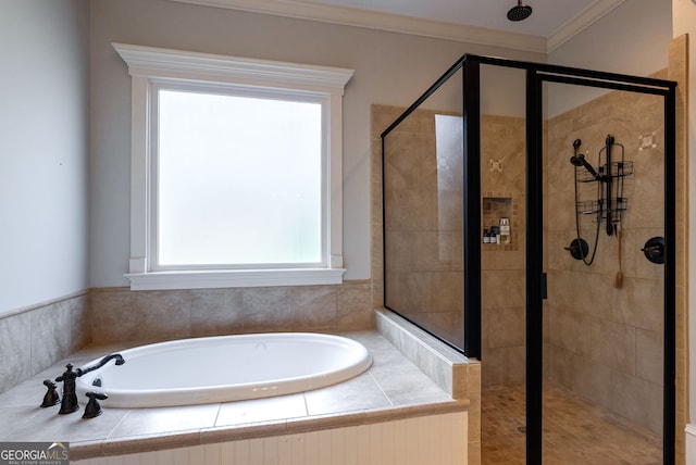 bathroom with separate shower and tub and ornamental molding