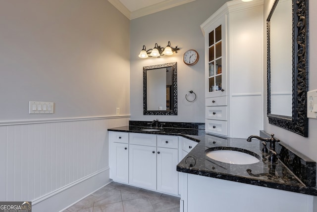 bathroom featuring tile patterned flooring, vanity, and ornamental molding