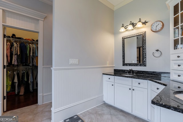 bathroom featuring tile patterned floors, vanity, and ornamental molding