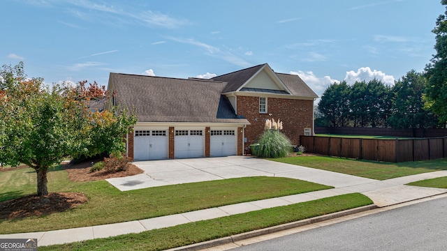 view of front property featuring a front yard and a garage