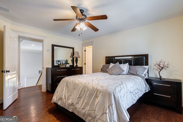 bedroom with ceiling fan, crown molding, and dark wood-type flooring