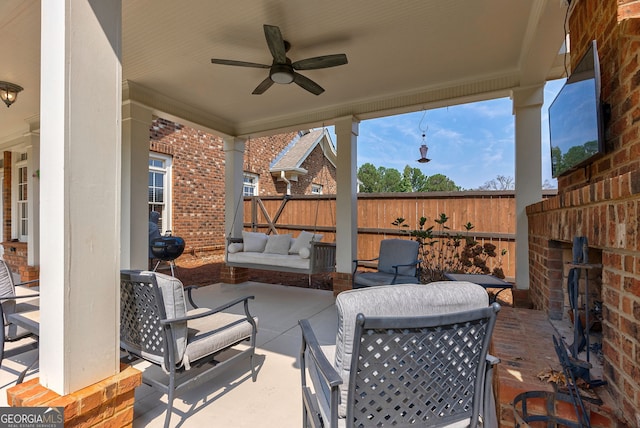 view of patio with ceiling fan and an outdoor hangout area