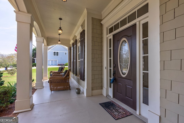 view of exterior entry with covered porch