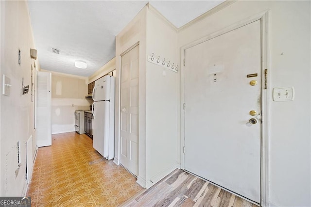 foyer entrance featuring wood-type flooring