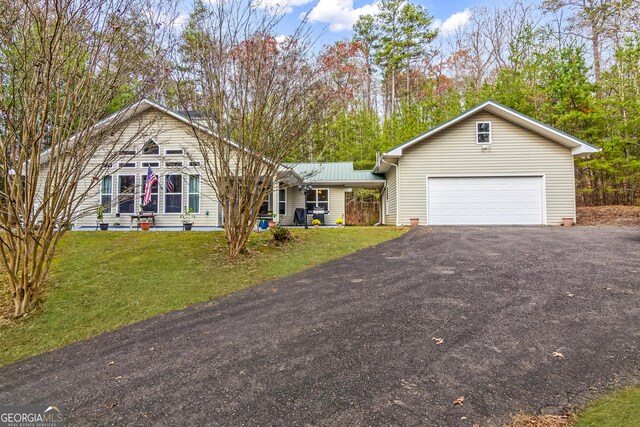 back of house featuring ceiling fan, a patio area, and a lawn