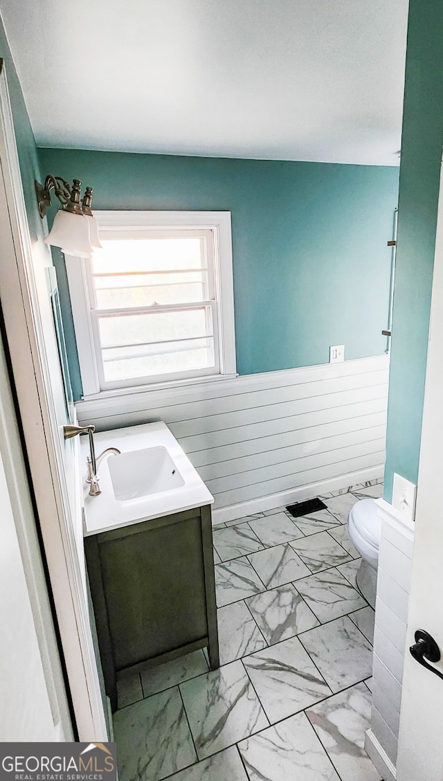 bathroom with vanity and toilet