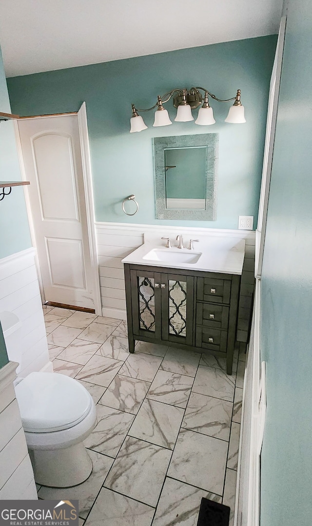 bathroom with vanity and toilet