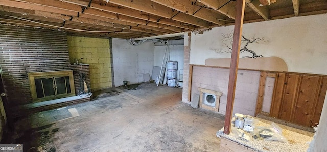 basement with a brick fireplace