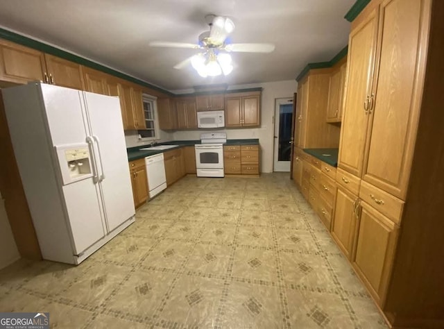 kitchen featuring ceiling fan, white appliances, and sink