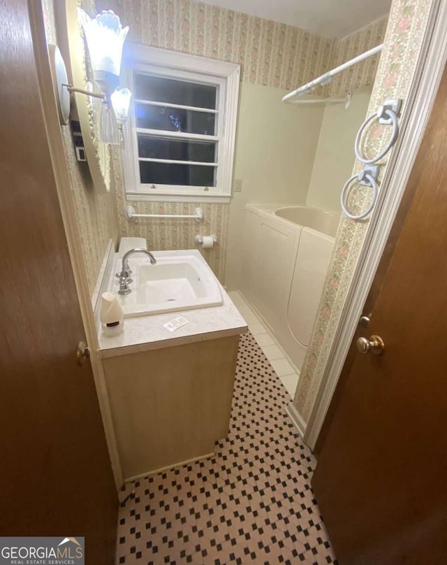 bathroom with vanity and tile patterned floors