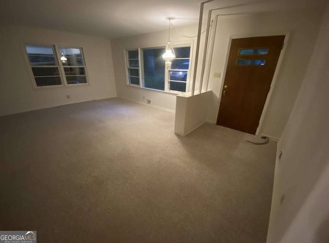 empty room featuring carpet floors