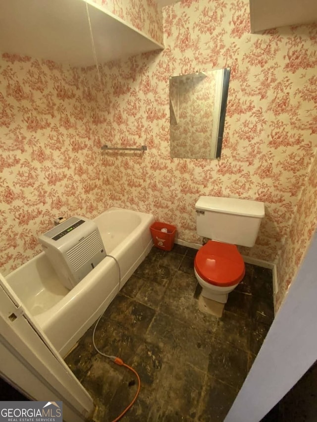 bathroom with tile patterned floors and toilet