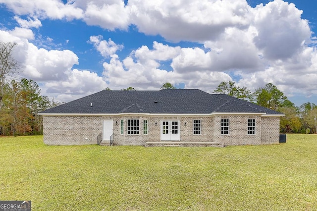 back of house with french doors, a yard, and a patio