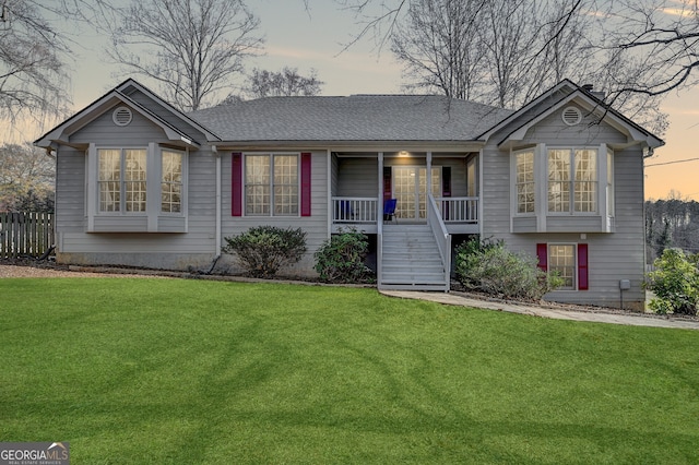 view of front of home featuring a yard and a porch