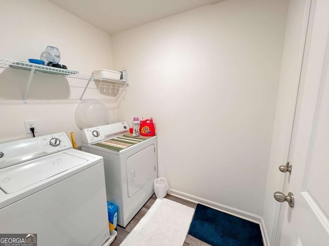 laundry area with independent washer and dryer