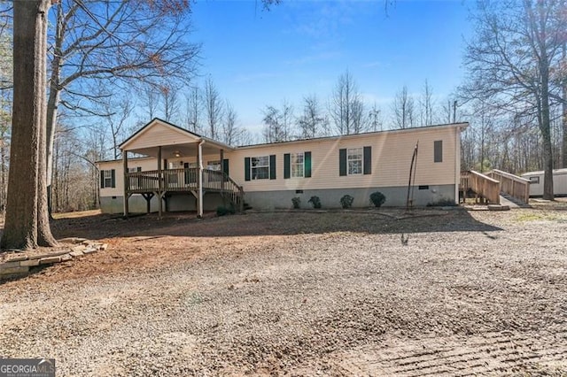 view of front of home featuring a wooden deck