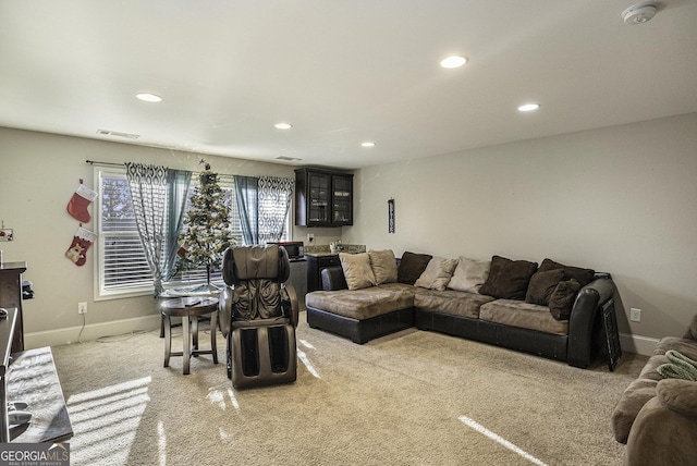 living room featuring carpet flooring and bar area