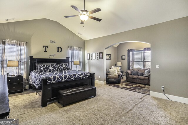 carpeted bedroom featuring ceiling fan and lofted ceiling