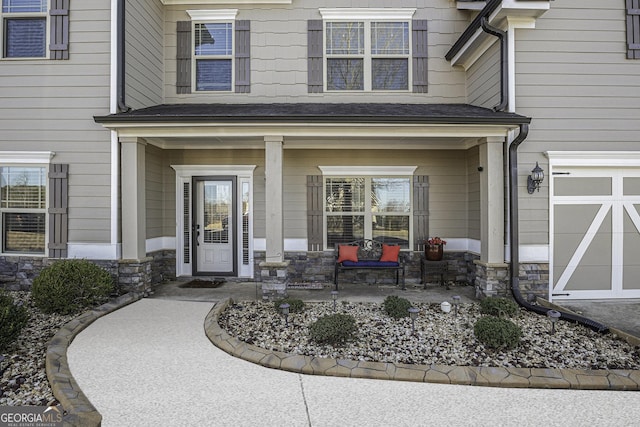 view of exterior entry with a garage