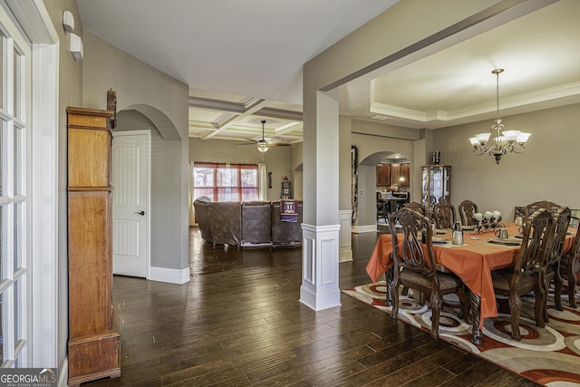 dining room featuring coffered ceiling, ceiling fan with notable chandelier, crown molding, dark wood-type flooring, and beam ceiling