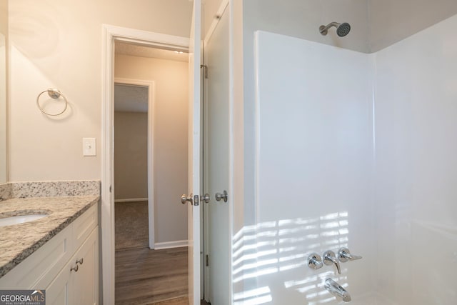 bathroom featuring vanity and wood-type flooring