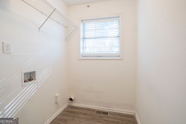 washroom with hookup for a washing machine and wood-type flooring