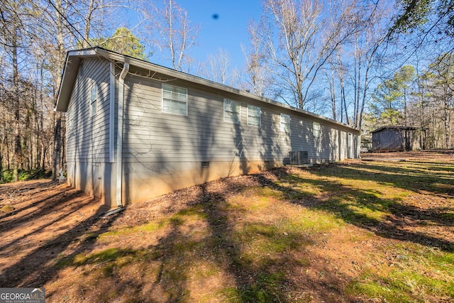 view of side of property with cooling unit