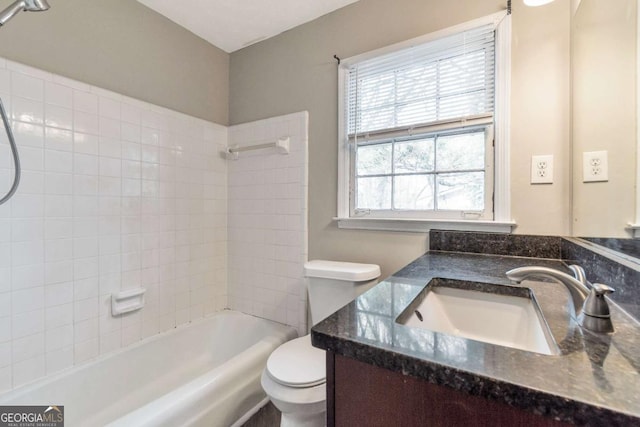 full bathroom featuring bathing tub / shower combination, vanity, and toilet