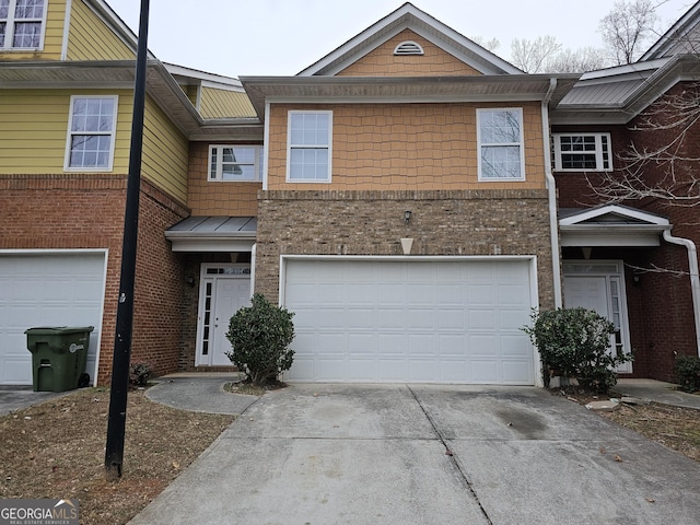 multi unit property featuring a garage