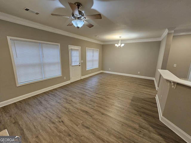 spare room featuring crown molding and dark hardwood / wood-style floors