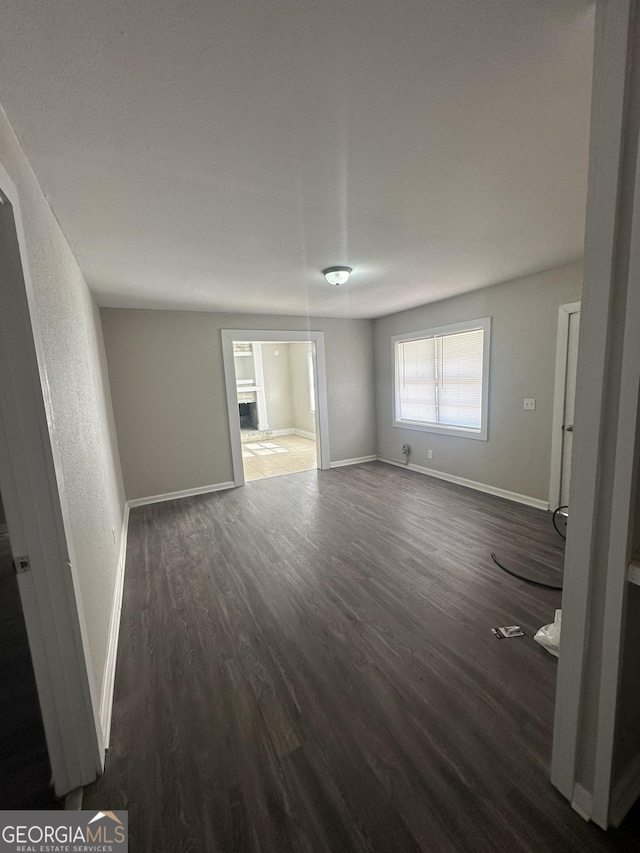 empty room featuring dark hardwood / wood-style flooring