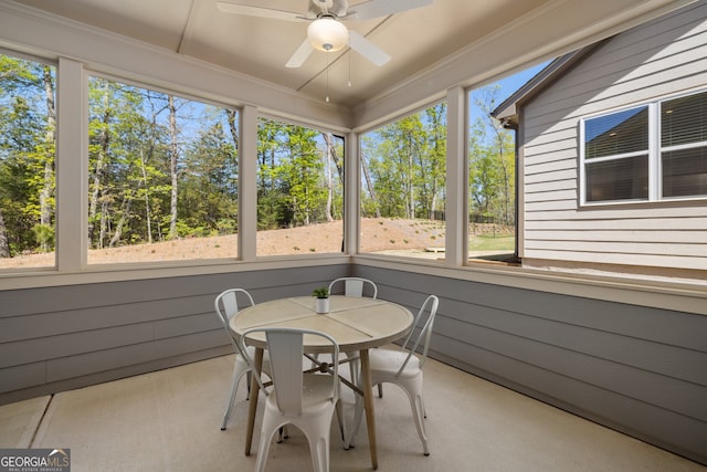 sunroom featuring ceiling fan