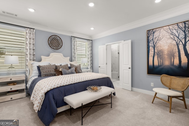 carpeted bedroom with crown molding and ensuite bath