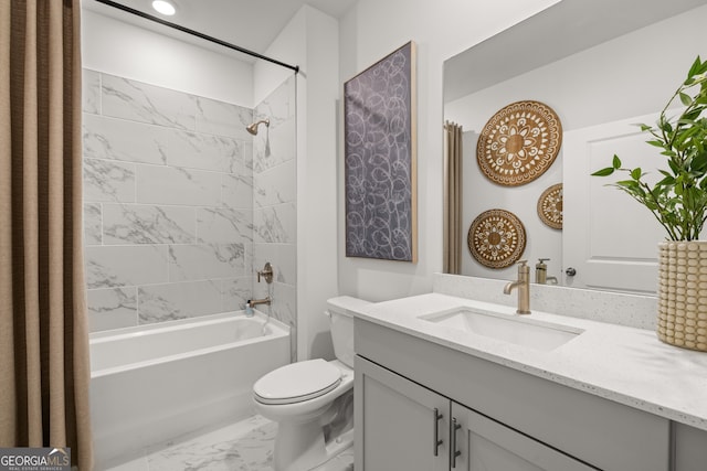 full bathroom with toilet, vanity, and tiled shower / bath combo