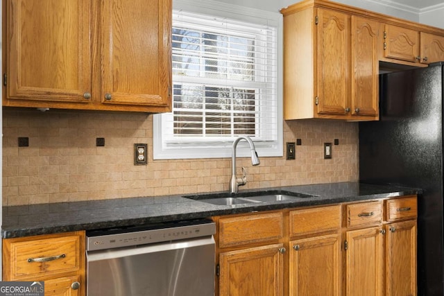 kitchen featuring dishwasher, black refrigerator, crown molding, sink, and tasteful backsplash