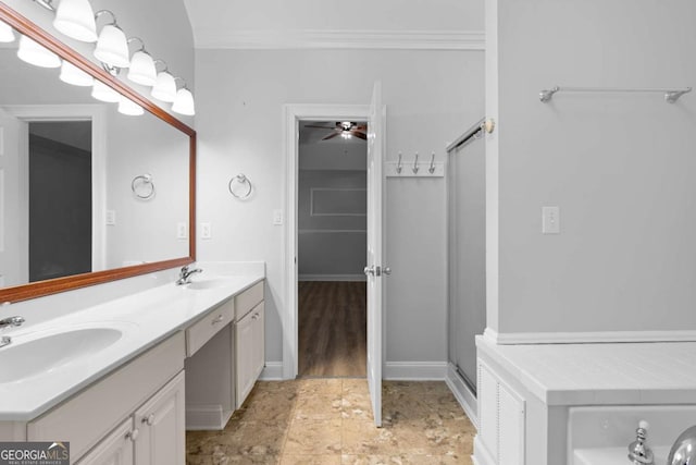 bathroom featuring walk in shower, vanity, and ornamental molding