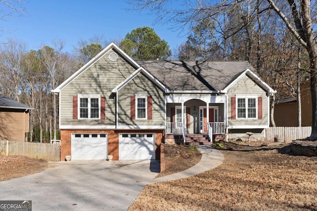 raised ranch with a porch and a garage