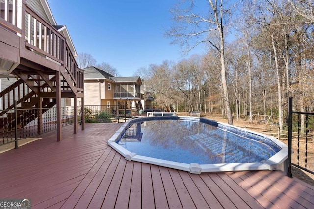 view of pool featuring a wooden deck