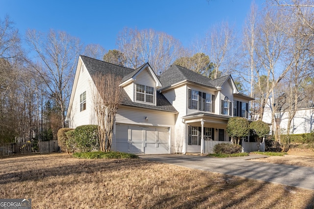 front facade with a porch and a garage