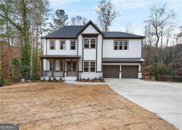 view of front of home featuring covered porch and a garage