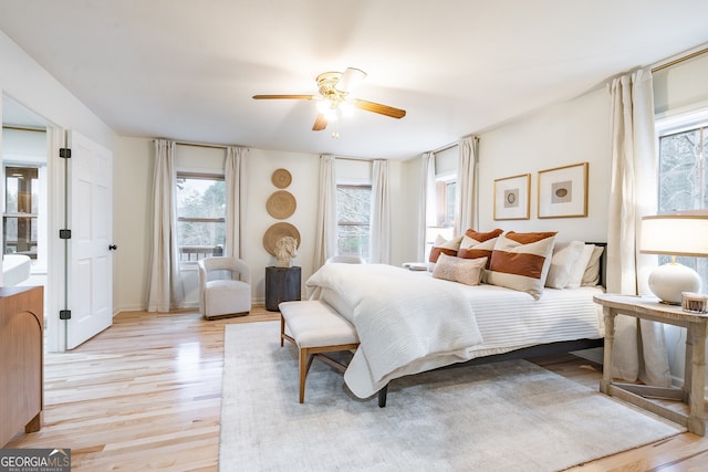 bedroom featuring light hardwood / wood-style flooring and ceiling fan