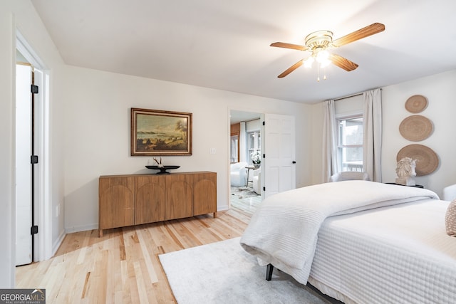 bedroom with ceiling fan and light wood-type flooring