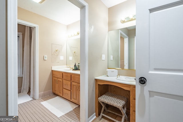 bathroom with tile patterned flooring and vanity