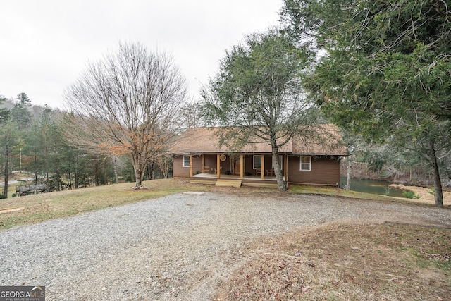 ranch-style home featuring covered porch