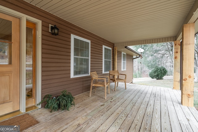 wooden terrace with covered porch