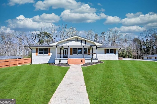 view of front of property with a front yard and a porch