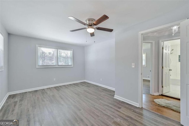 unfurnished room featuring hardwood / wood-style flooring and ceiling fan