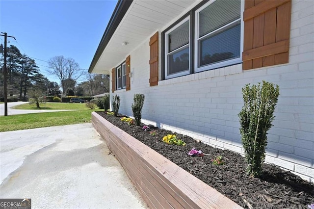 view of home's exterior with a lawn