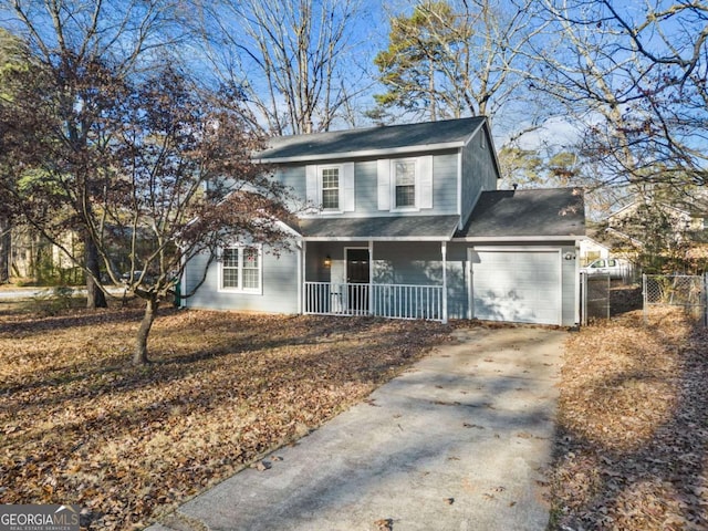 front of property with a garage and covered porch